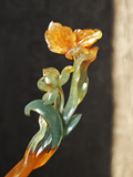 Golden Butterfly Dancing on Orchid